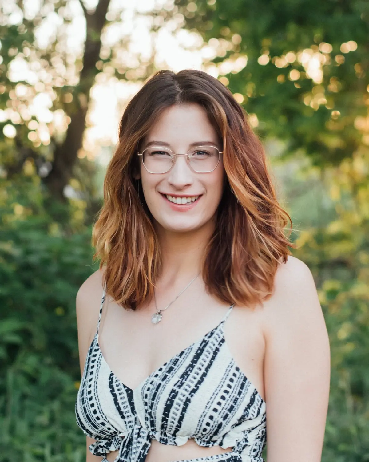 Kimberly Kline smiling outdoors in the evening sun